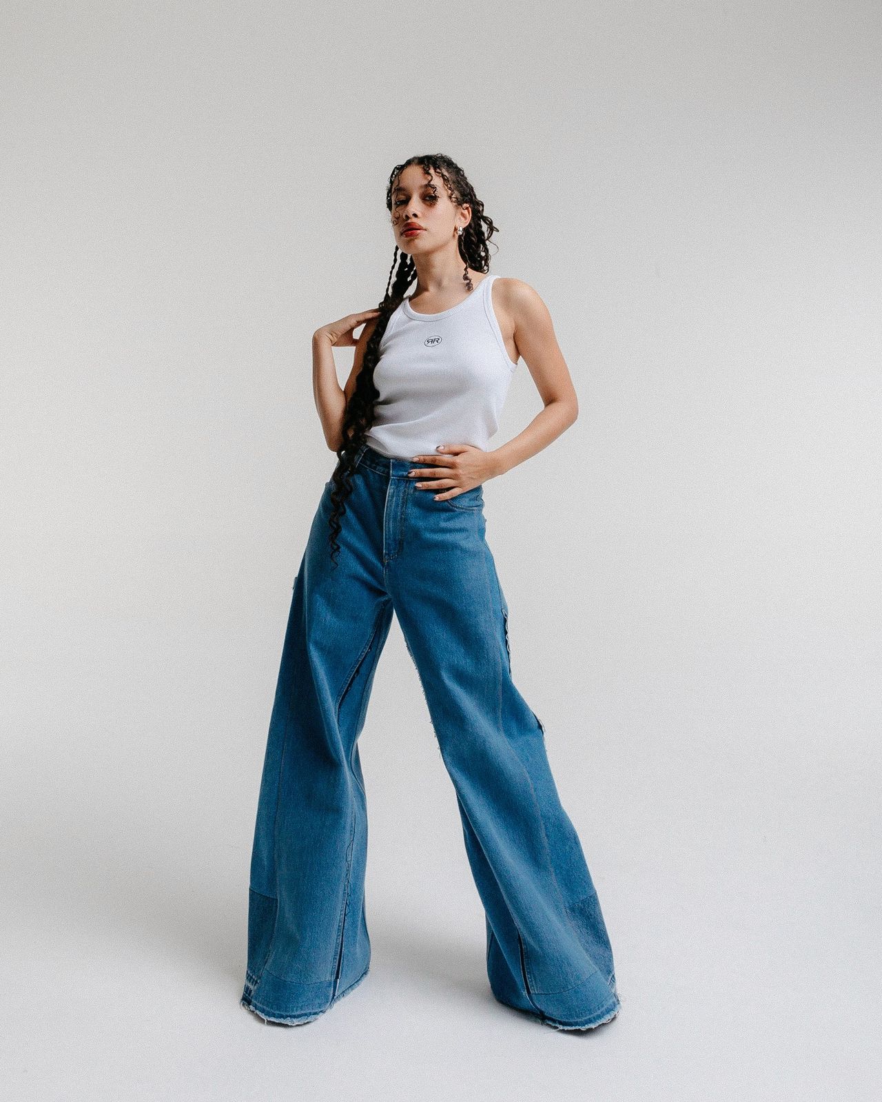 Via Concept Store fashion editorial campaign model in white tank top wide-leg blue jeans — Thomas Habr fashion photographer