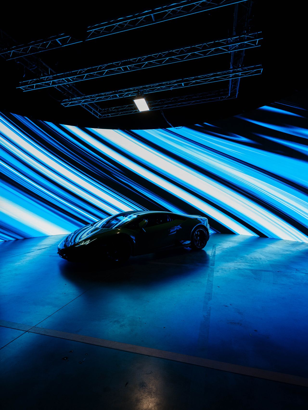 Lamborghini official shoot black luxury car on stage dramatic lighting — Thomas Habr automotive photographer