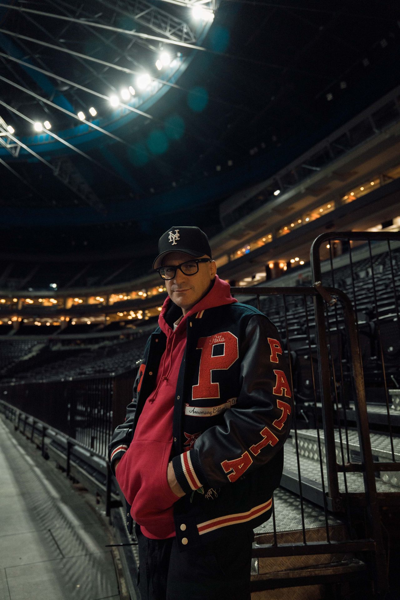 DJ Wich portrait music artist shoot stadium night varsity jacket — Thomas Habr music photographer Prague