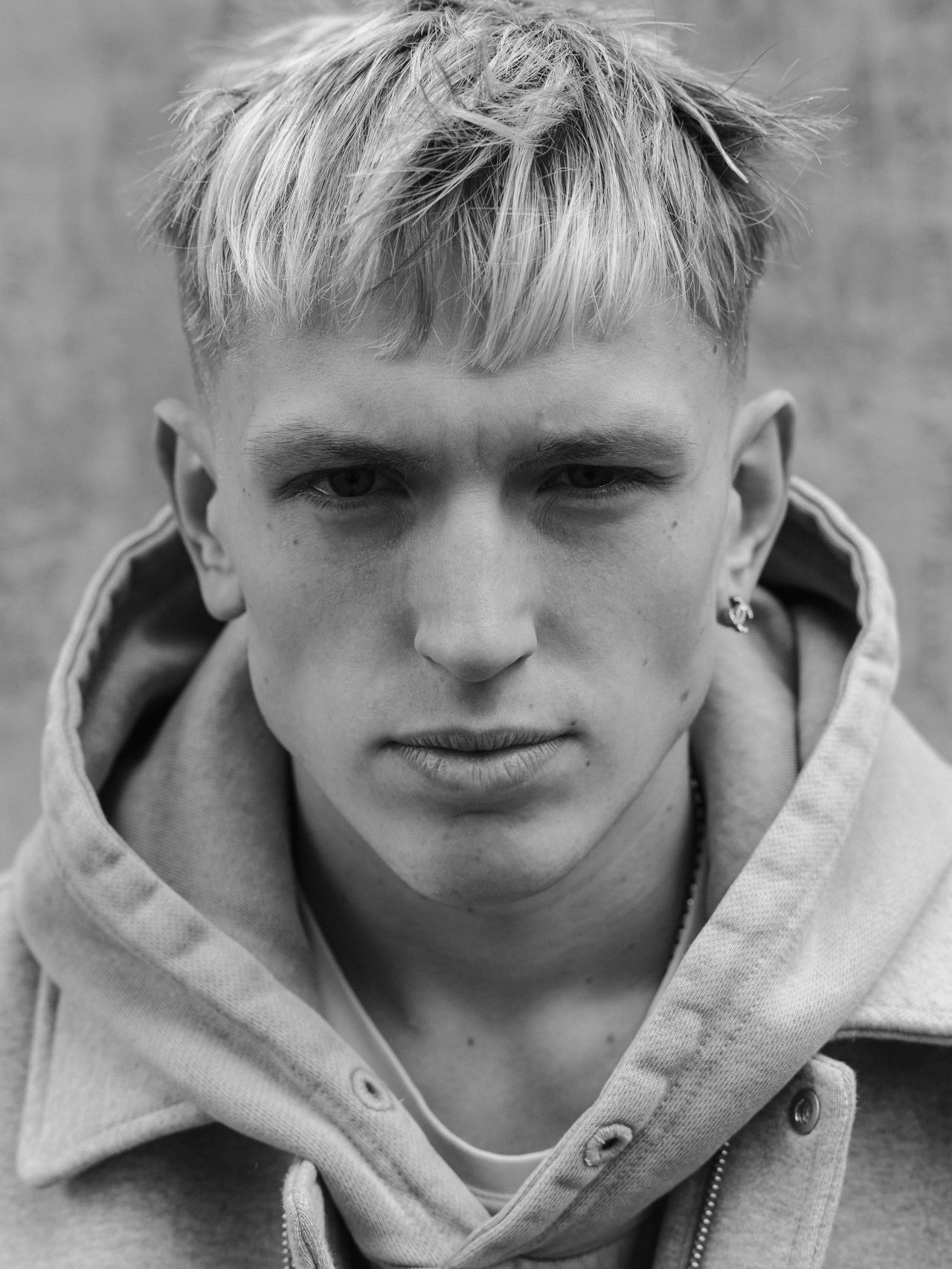 Black and white portrait young male model bleached hair hoodie — Thomas Habr music artist photographer