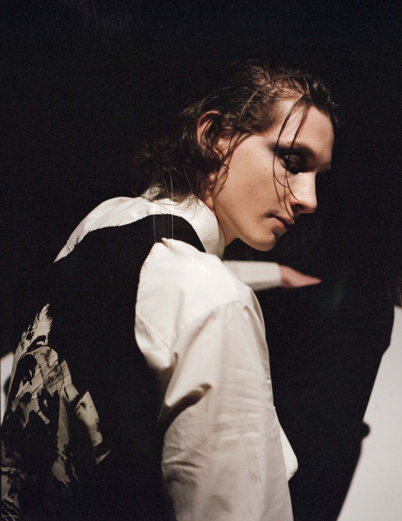 Editorial moody portrait man in white shirt dramatic shadow light — Thomas Habr photographer